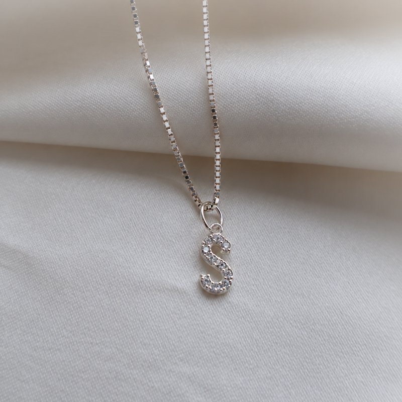 "Alias" silver letter with white stones (charm)
