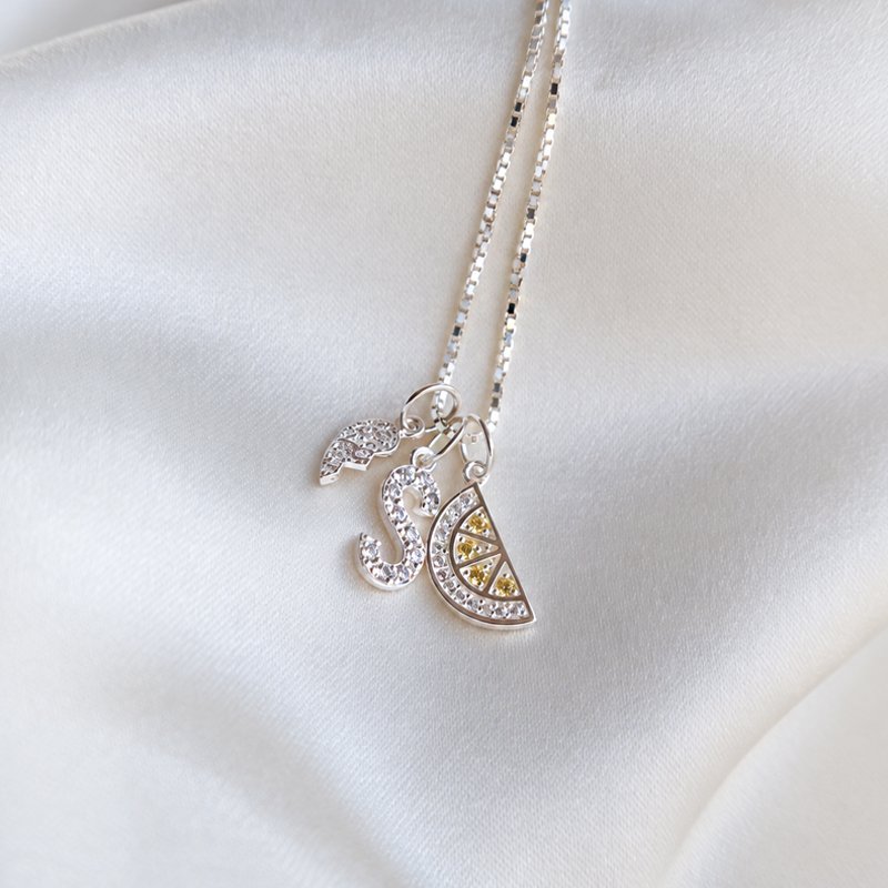 "Alias" silver letter with white stones (charm)