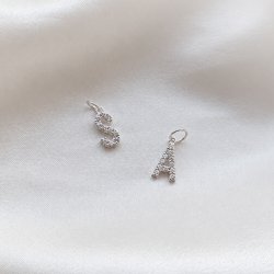 "Alias" silver letter with white stones (charm)