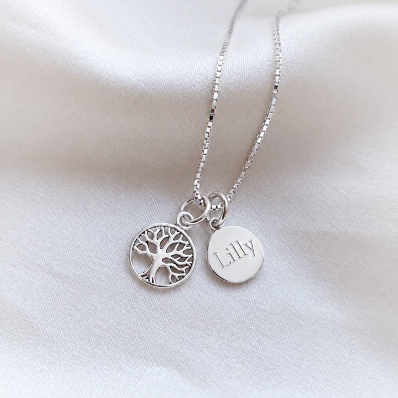 Silver charm with Tree of Life amulet