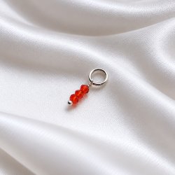 Silver charm with 3 small red glass beads