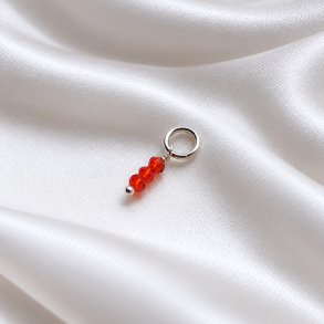 Silver charm with 3 small red glass beads
