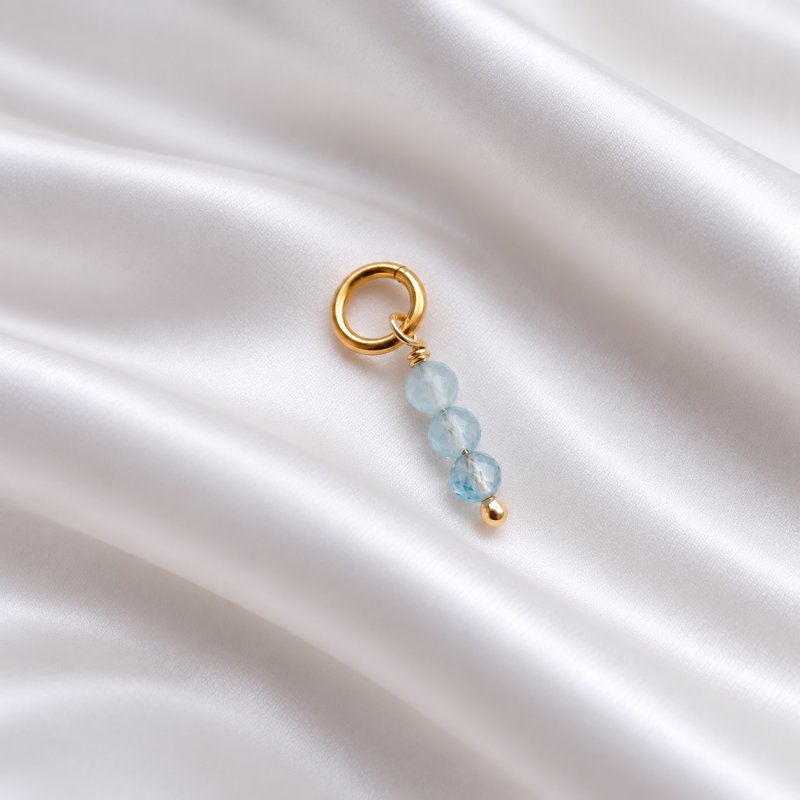 "Aquamarine" gold charm with blue aquamarines
