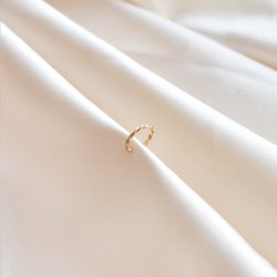 "Swirl" earcuff i 18k gullbelagt