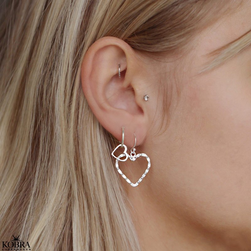 "Adore You" heart earrings in silver with a beaten surface
