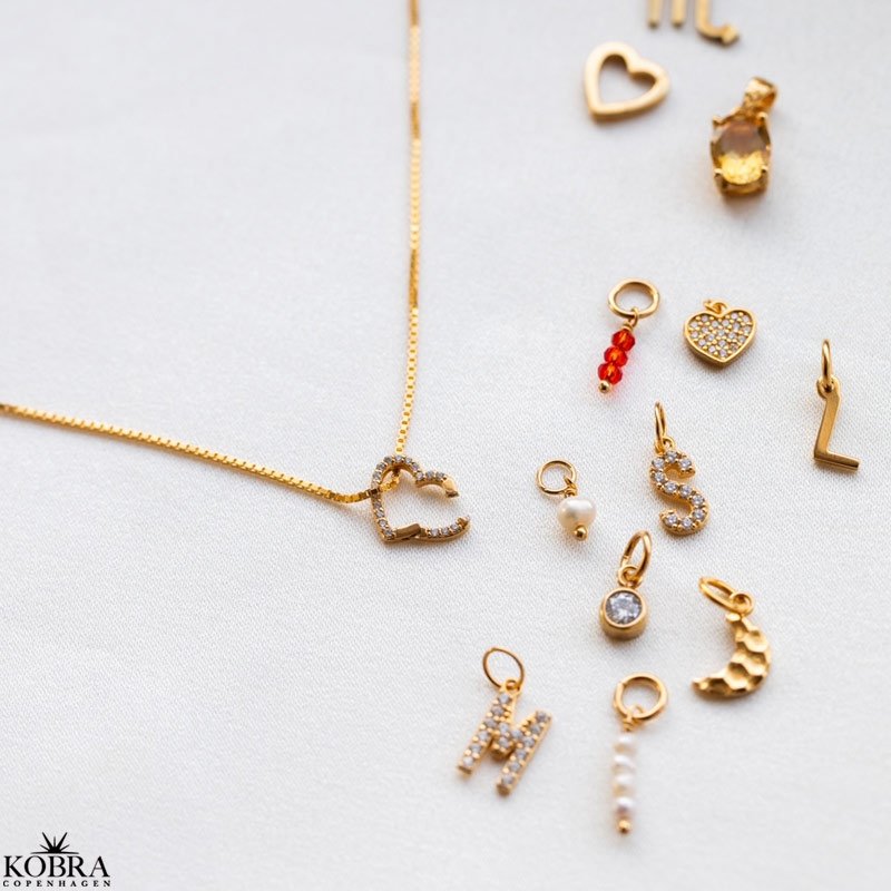 Charm i guld med Livets Tr amulet