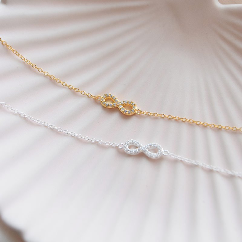 "Always" 18k guldpl�terat o�ndlighetsarmband med stenar