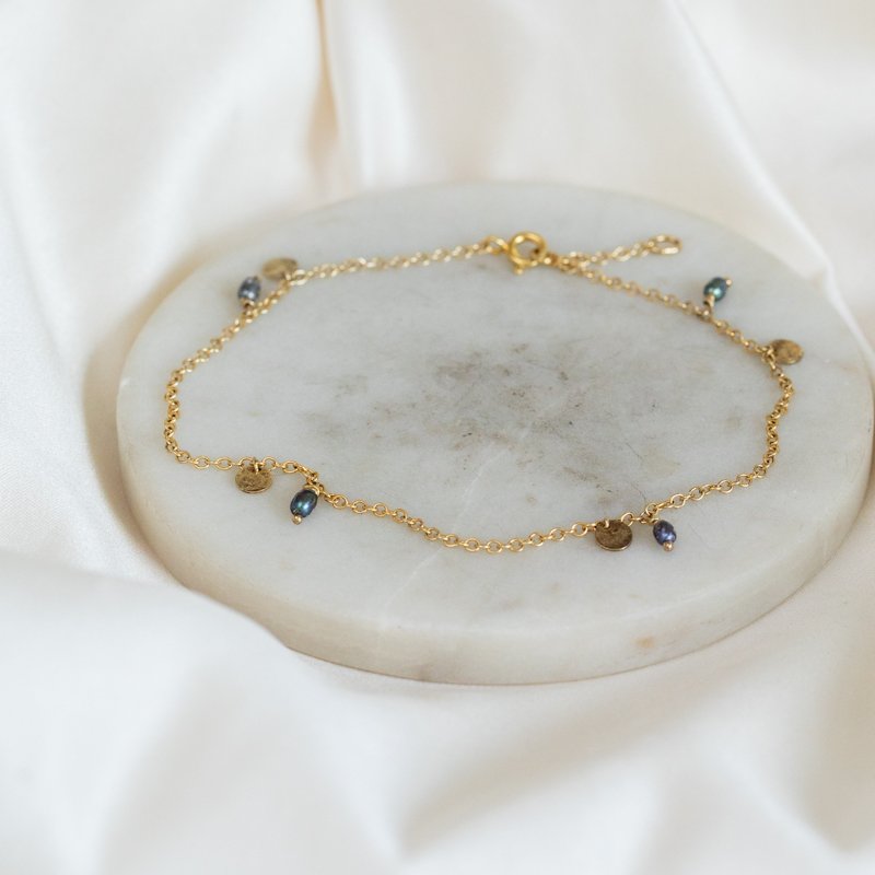 "Pittioni" gold ankle chain with blue freshwater pearls and small amulets
