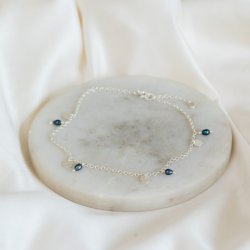 "Pittioni" silver ankle chain with freshwater pearls and small silver amulets