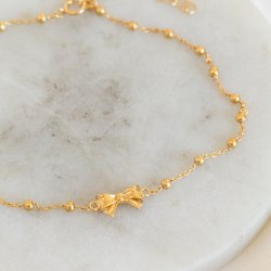 "Melanie" ankelkedja med rosetter i guld