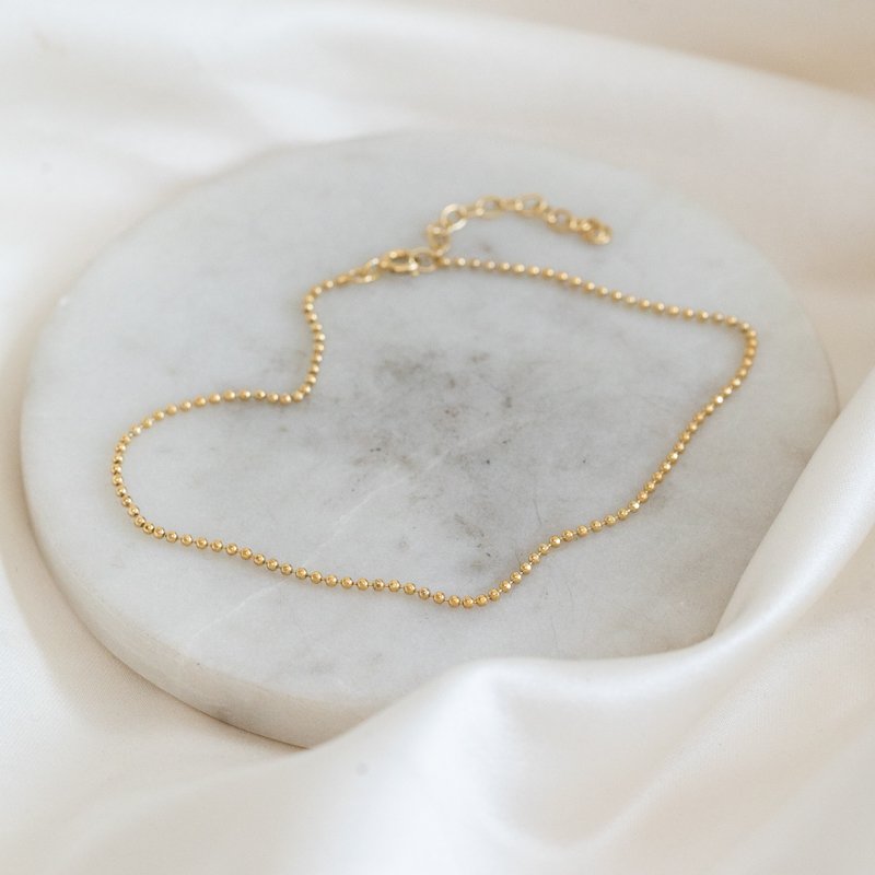 "Mellow" ankle chain with gold balls