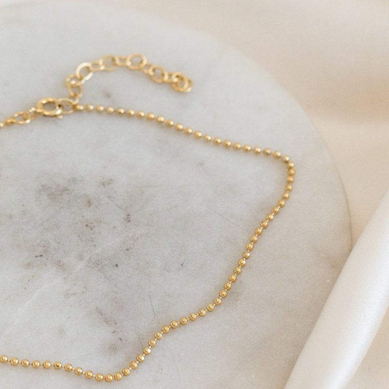 "Mellow" ankle chain with gold balls