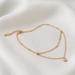 "Kaja" gold ankle chain with gold balls and white stone