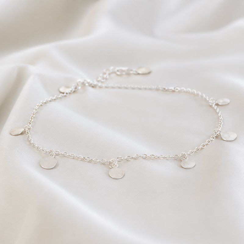 "Tennis" anklet with small silver amulets