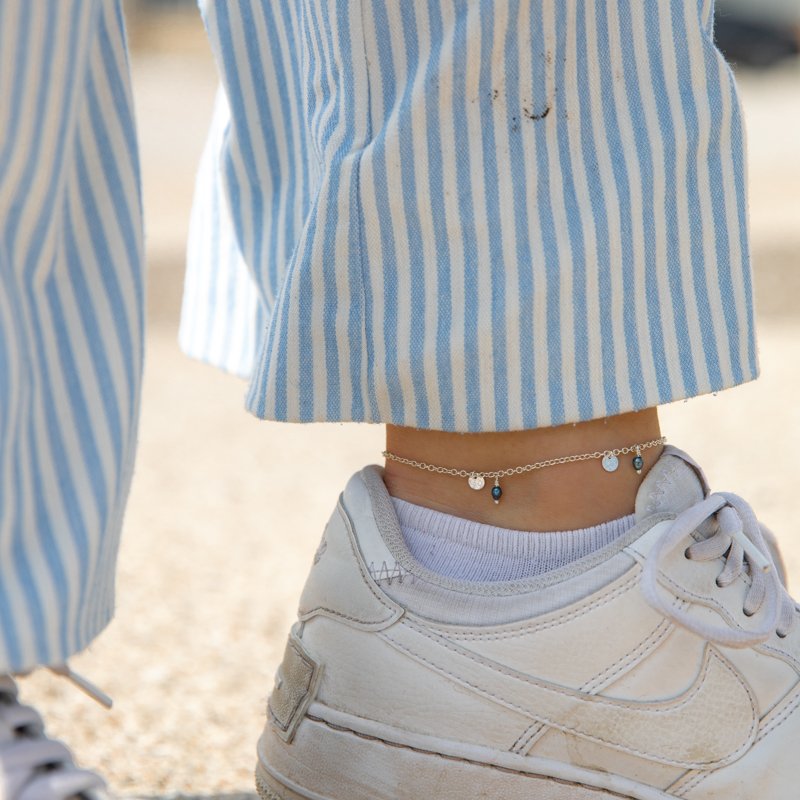 "Pittioni" silver ankle chain with freshwater pearls and small silver amulets