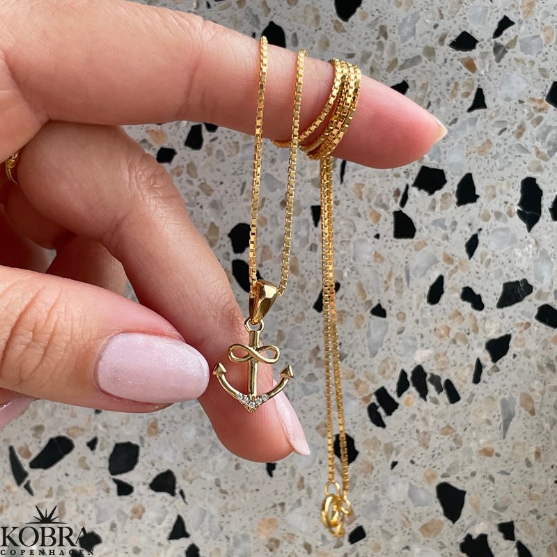 "Abira" gold plated anchor necklace with infinity and white stones