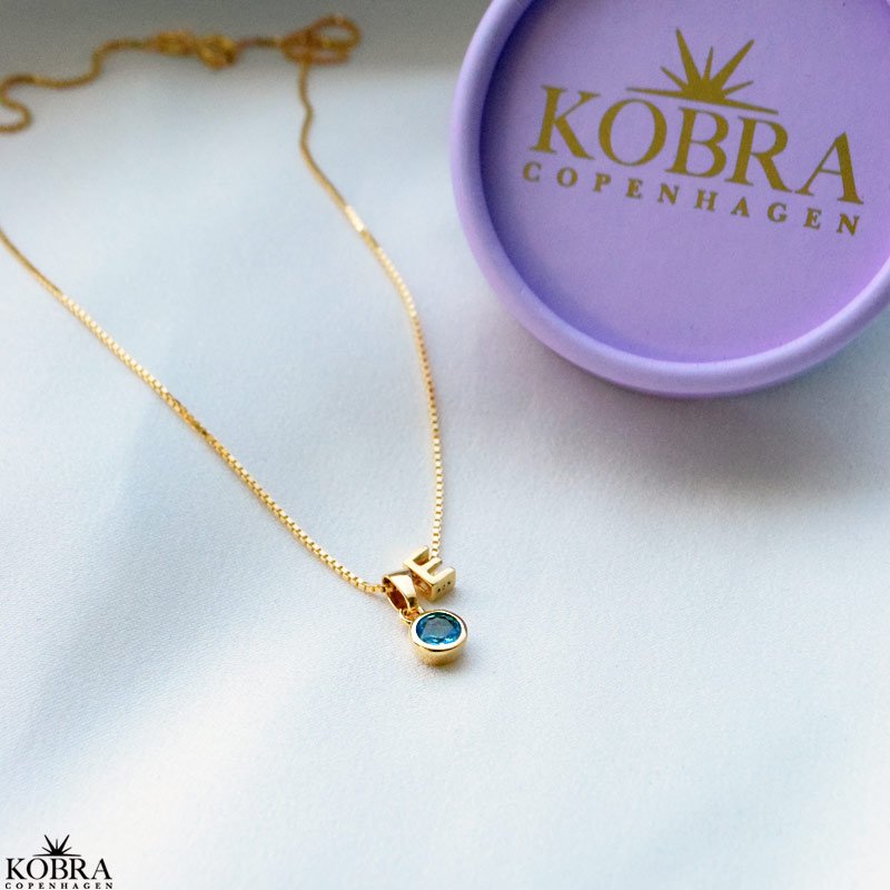 Birthstone charm in gold