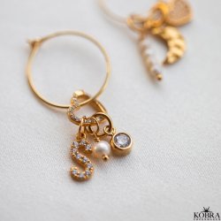 "Alias" gold letter with white stones (charm)