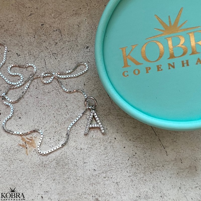 "Zoey" sterling silver letter with white stones