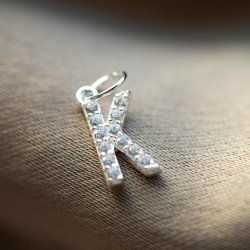 "Alias" silver letter with white stones (charm)
