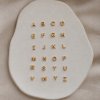 Chloe 18 carat plated gold silver letter pendant
