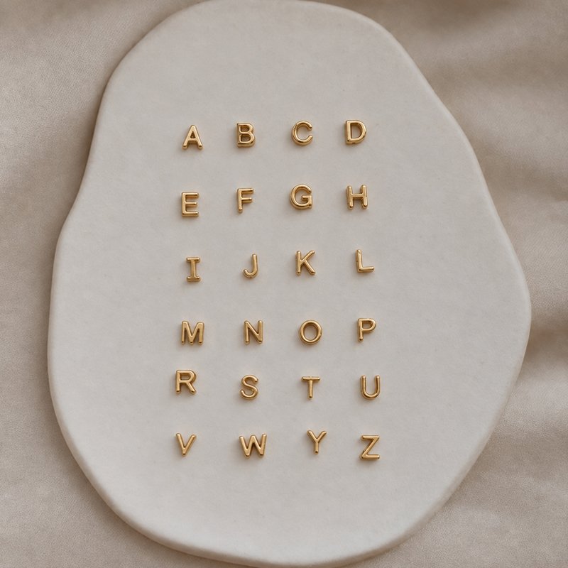 Chloe 18 carat plated gold silver letter pendant