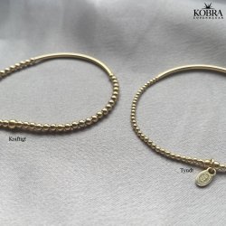 "Carly" Armbnd med tynd plade og sm guldkugler