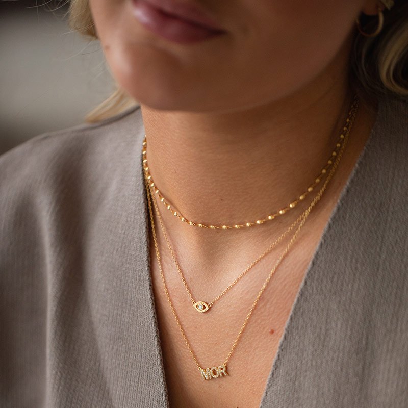 "MOR" guld halsk�de med sten