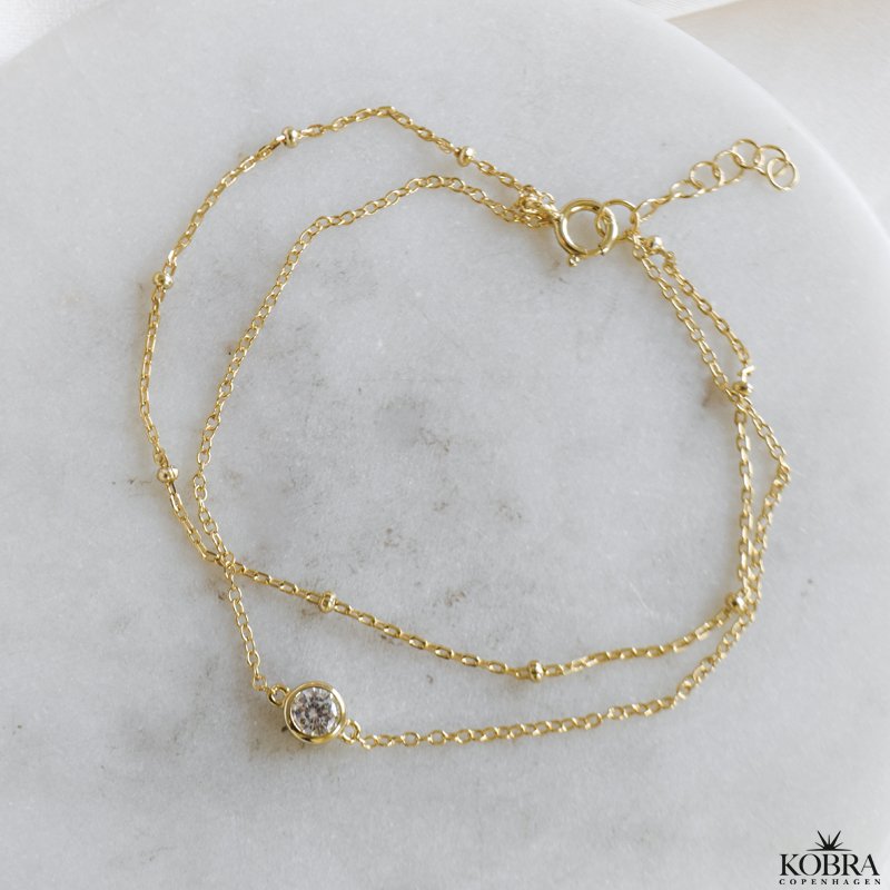 "Elara" guld armbnd med dobbeltkder
