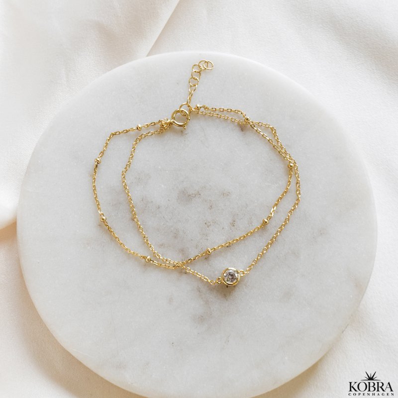 "Elara" guld armbnd med dobbeltkder