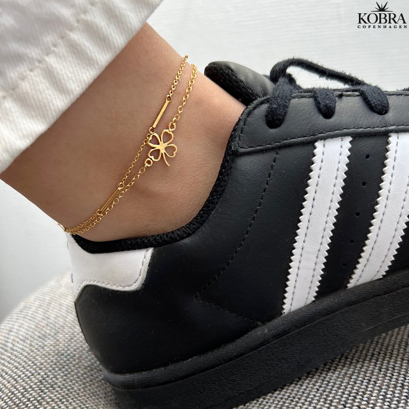 "Fortuna" ankelkde i guld med smuk firklver