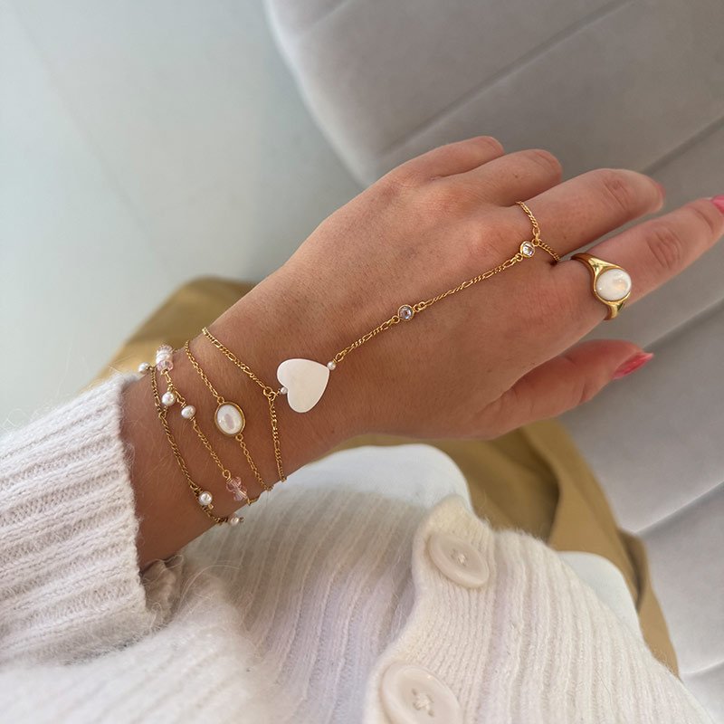 "Wild Heart" gold plated hand chain with mother of pearl