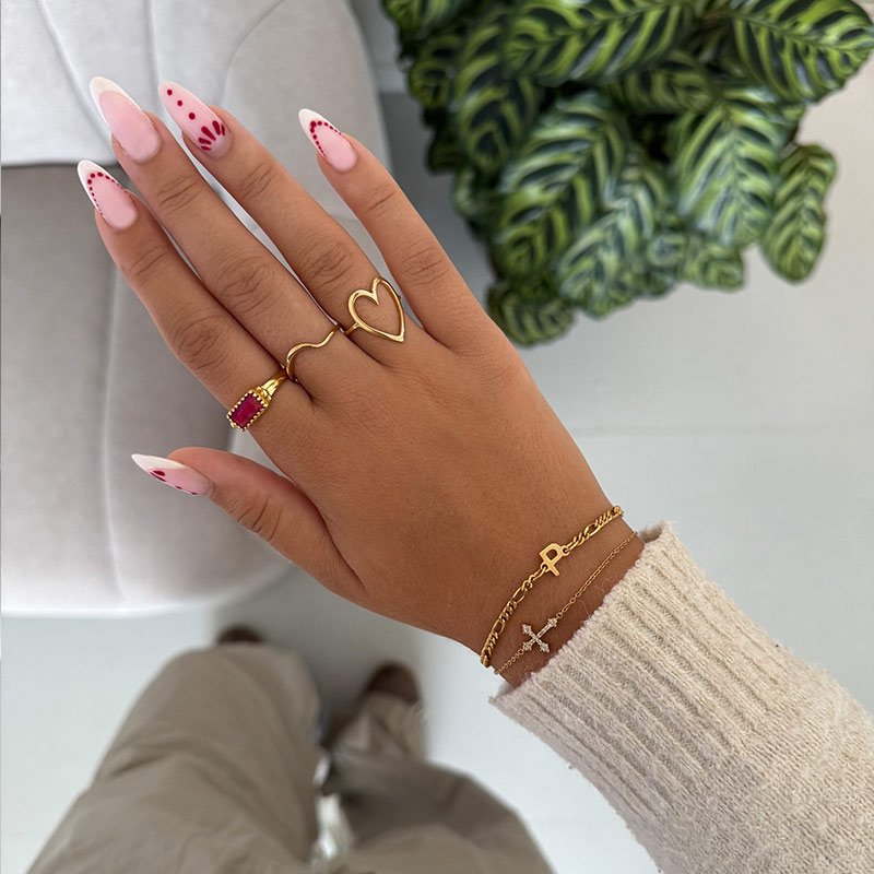 "Princess" gold ring with red corundum