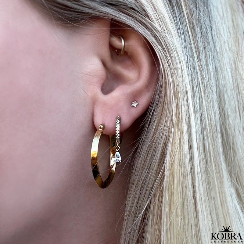 "Emilie" 18 carat gold plated hoops with a twist