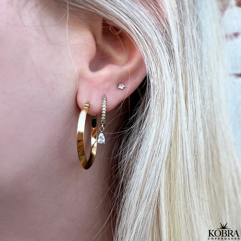 "Emilie" 18 carat gold plated hoops with a twist