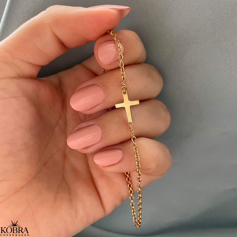 "Trust" 18 carat gold plated cross bracelet