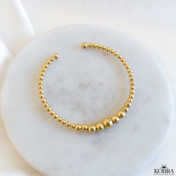 "Mella" guld armbnd / cuff med guld kugler