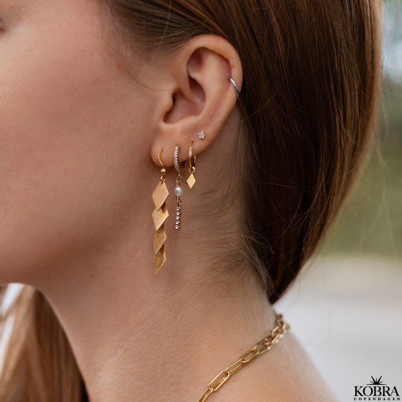 "Stardust" small star earrings in gold