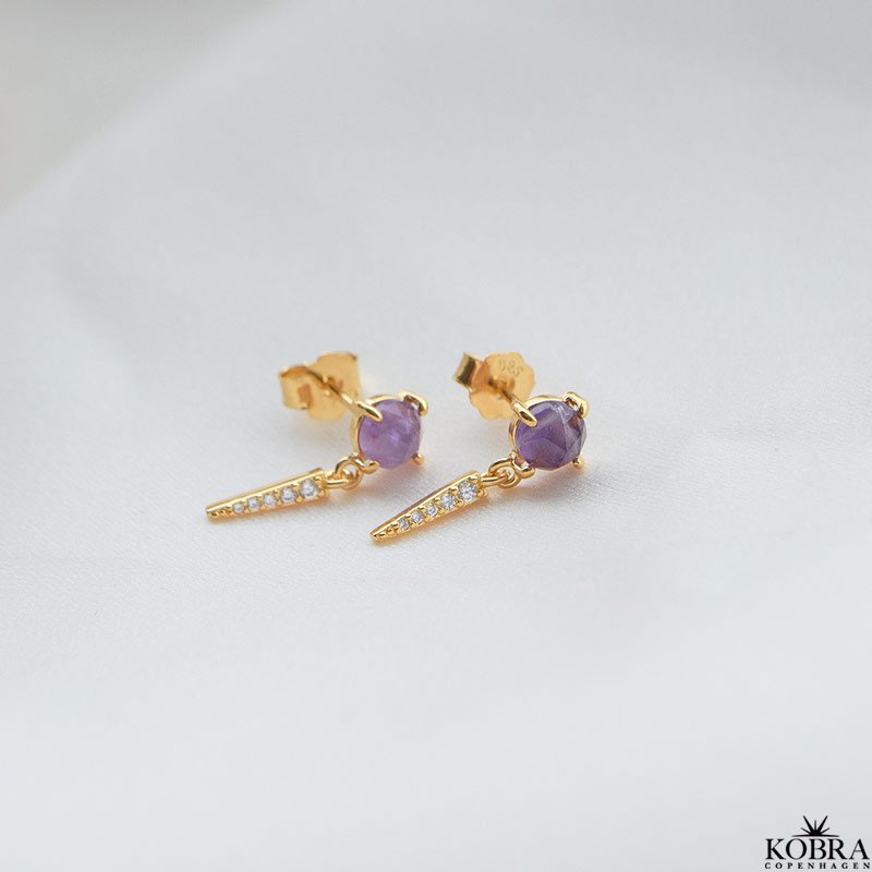 "Cilja" guld reringe med lilla sten