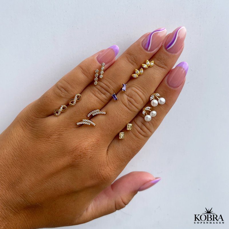 "Bound" Infinity earrings in gold with stones