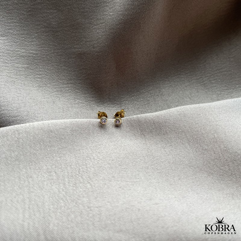 "Purple" guld restikker med lilla sten