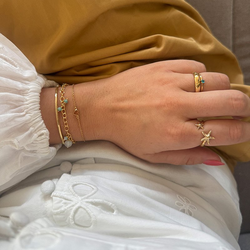 "Aurora" fine golden ring with small blue stone