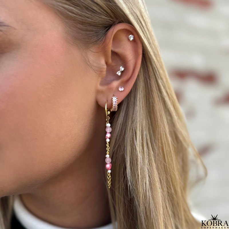 "Lori" guld reringe med pink sten