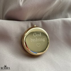 Rund guldfarvet pilleske, med personlig gravering