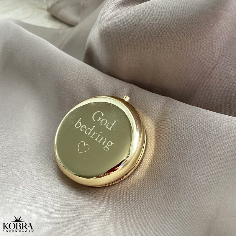 Rund guldfarvet pilleske, med personlig gravering