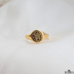 "Blazing Star" gold signet ring with your zodiac sign