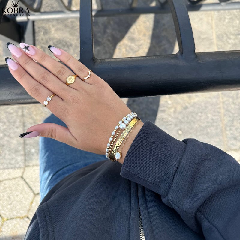 "Blazing Star" gold signet ring with your zodiac sign