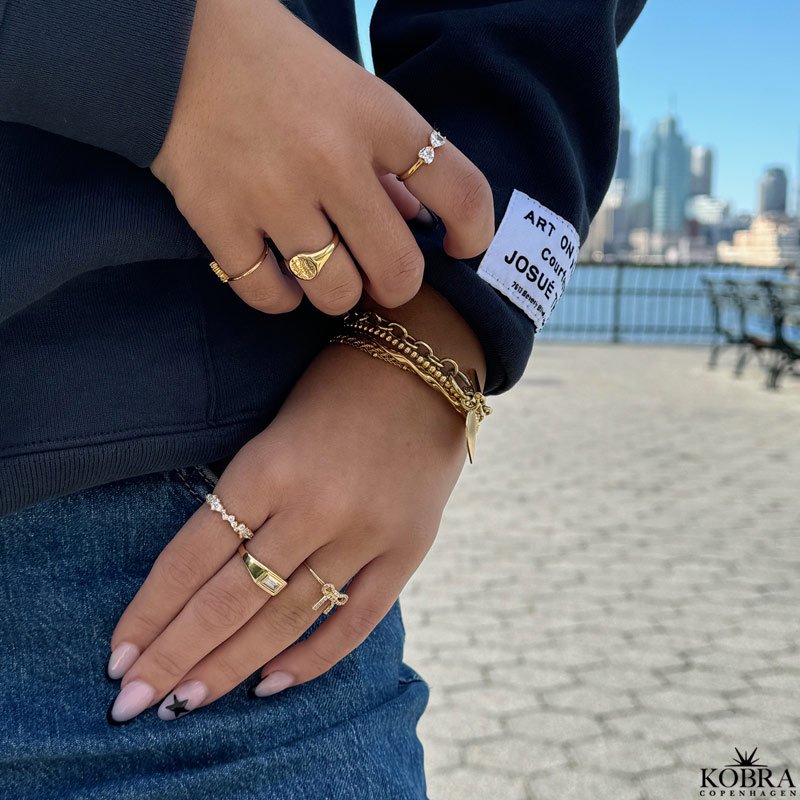 "Mikami" 18 carat gold plated ring with white stones