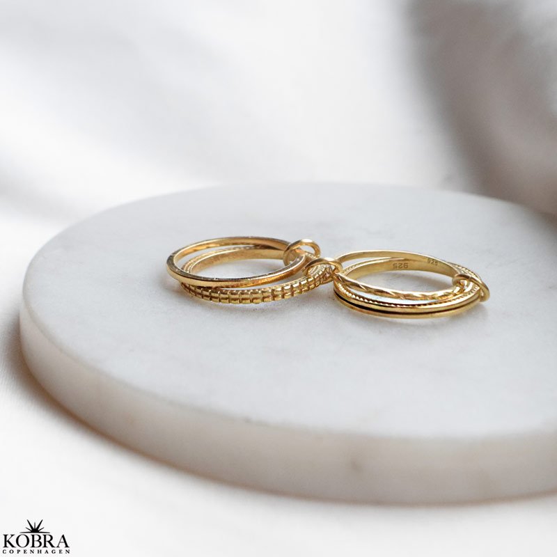 "Nikki" stacking, stress fidget ringe i guld