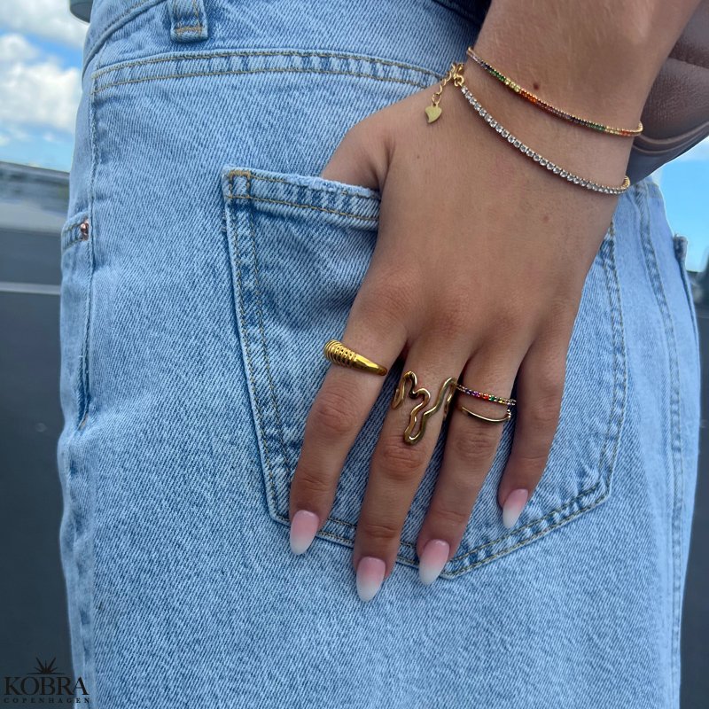 "Ivy" tennis armbnd i guld